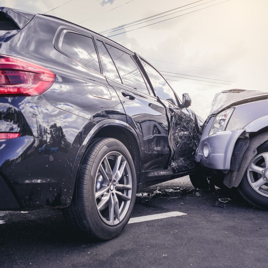 Car crash dangerous accident on the road. SUV car crashing beside another one on the road..